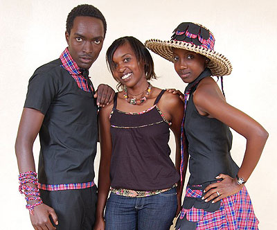 Colombe Ituze Ndutiye (C) poses for a photo with local models.  The New Times / Courtesy.