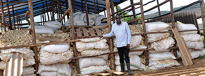 Rubagumya at one of his maize granaries. The New Times / Peterson Tumwebaze