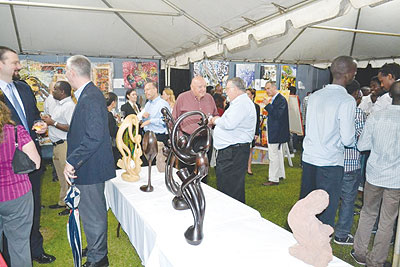 Art lovers braved the heavy rain to attend the art exhibition held at U.S Deputy Chief of Missionu2019s residence in Kiyovu.