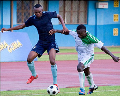 Police striker JacquesTuyisenge (L) tries to beat off a challenge from SCKiyovu's Fiston Nyarugeta in a league match last season. Times Sport / File.