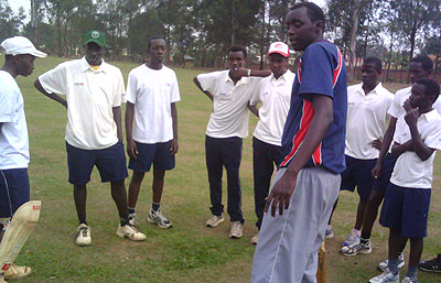 The U-17 boys team coach giving technical tips to his youthful squad. The New Times / Courtesy.