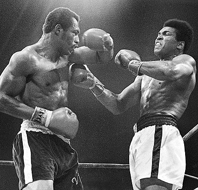 Ali (right) winces as Norton catches him with a left hook to the head in the '73 re-match. Net photo