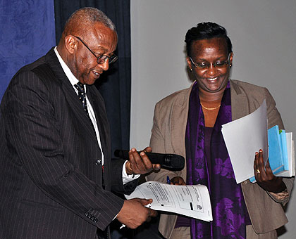 NEC president Prof. Kalisa Mbanda (L) and commissioner Fatina Mukarubibi after releasing the final results  of the just concluded parliamentary polls at the commissionu2019s headquar....