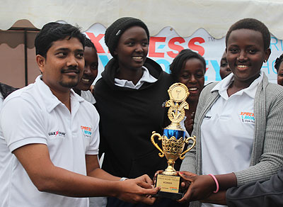 Queens of Victory Cricket Club players receive the trophy after beating Charity CC in the UAE Exchange & Xpress Money T20 finals. The New Times / Courtesy.