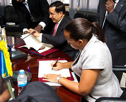 Abdelaziz Khelef, the director General of Badea (L) and the Ministry of Finance permanent secretary Pitchette Sayinzoga sign the Rwf 6.7 billion deal yesterday.   The New Times/ Timothy Kisambira. 