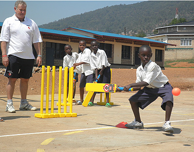 A kid tries to bat during a CWB training last year. Nine members of the UK-based charity organization returned to Rwanda on Sunday. Times Sport / Courtesy.