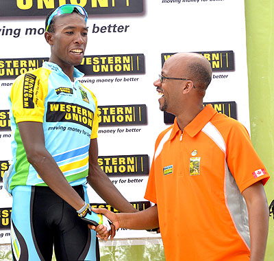 Rwanda Cycling Federation boss Aimable Bayingana (right) congratulates Adrien Niyonshuti during stage five of last year's Tour du Rwanda. Times Sport/ T. Kisambira