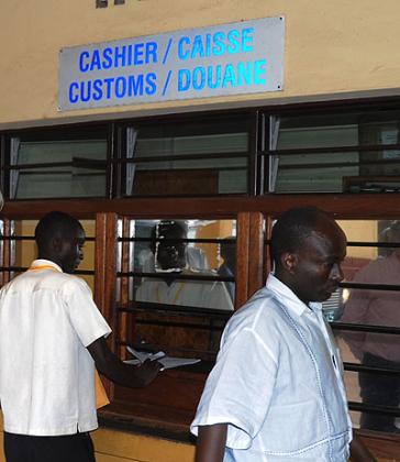 A customer pays taxes at the Gatuna border post.  The meeting is an opportunity for the tax bodies to share their experiences, challenges and work out solutions to the challenges h....