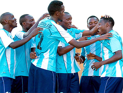 Jean du2019amour Uwimana, right, celebrates with team mates after scoring Policeu2019s second goal against Etincelles. Times Sport/ T. Kisambira.