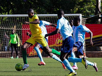 Hakiri Mabula seen dribbling past Police defenders, scored the third goal for AS Kigali from a brilliant header. Sunday Sports/T. Kisambira