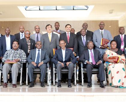 President Kagame (centre) in a group photo with some senior RRA officials and most compliant taxpayers. Sunday Times/Village Urugwiro