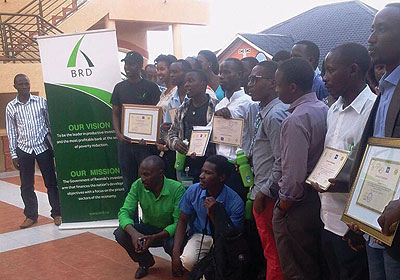 Participants pose with sponsors for a group photo after the training. The New Times / Stephen Nuwagira