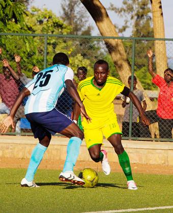 Striker Jimmy Mbaraga (left) scored and was involved in the other as AS Kigali beat Police 3-0 on Saturday to stay top of the league table. Times Sport / T. Kisambira.