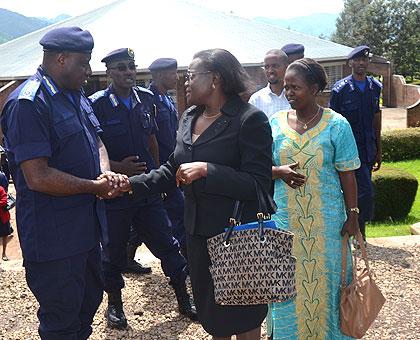 Gasana chats with UN Women deputy representative Anyangwe, as CID Commissioner Theos Badege looks on. Sunday Times/J du2019Amour Mbonyinshuti