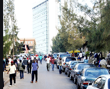 Many commercial buildings erected before 2007 lack parking spaces, leaving motorists with limited options  The New Times/ J. Mbanda.