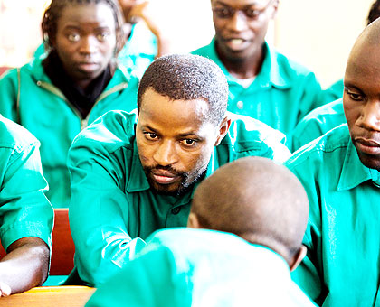 Lt. Mutabazi (C) and his co-accused before the Nyamirambo Military Tribunal yesterday. The New Times/Timothy Kisambira