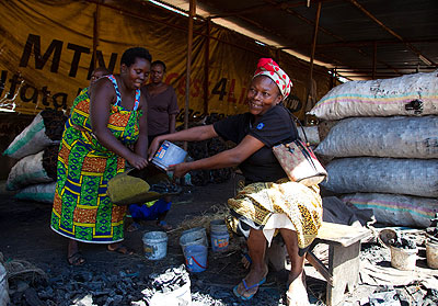 A former prostitute selling charcoal in a market. The New Times/ JP Bucyensenge.