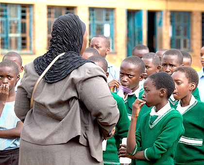 A teacher addressind pupils. The New Times/ Timothy Kisambira.