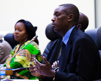 Executive Secretary of CNLG, Jean de Dieu (R) and the deputy speaker,  Jeanne du2019Arc Uwimanimpaye, addressing Parliament.  The New Times/ Timothy Kisambira.