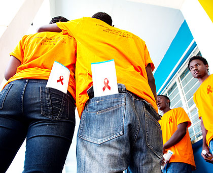 Youth engage in a discussion after the celebrations to mark the World Aids Day at Petite Stadium yesterday. The government has launched a new five-year strategy to fight HIV infection, with a focus on the youth. The New Times/ Timothy Kisambira.