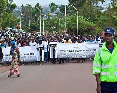 Workers in the Prime Ministeru2019s Office match in commemoration of the 1994 Genocide victims in July, 2013. The New Times/ Courtesy.