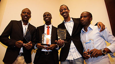 TNT journalists pose in a group photo with their awards .  All photos/T. Kisambira.