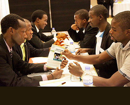 Job seekers (R) and representatives of Institutions meet yesterday.  The New Times/ John Mbanda