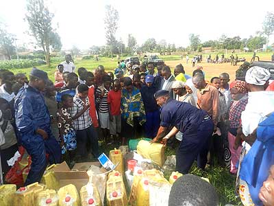 Residents witness as police destroy illicit alcohol and marijuana. The New Times S. Rwembeho.  The New Times/ S.Rwembeho