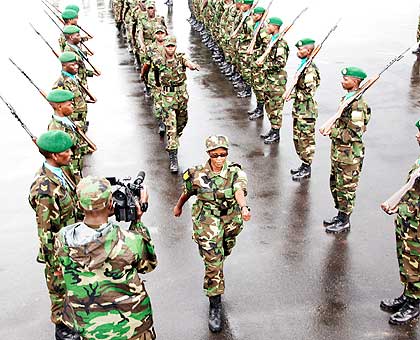 A peacekeeping officer leads her regimen to board a plane to South Sudan in May last year. RDF is sending peacekeepers to war-tornCAR.The New Times/ File.