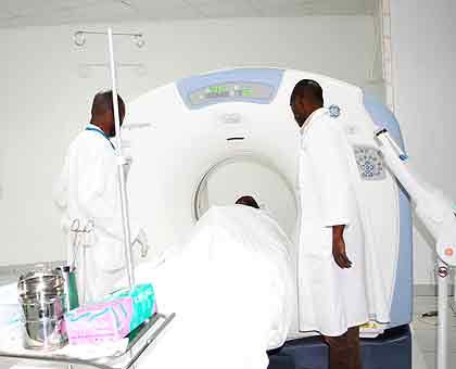 Doctors at Chub examine a patient with the CT scan machine. The New Times/ JP Bucyensenge.