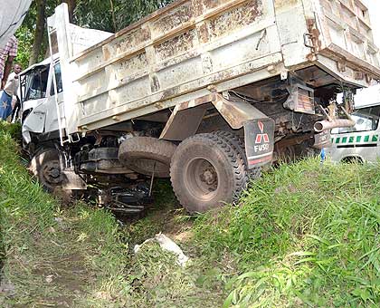 The wreckage of the truck that veered off the road killing two people. J. Mbonyinshuti. 