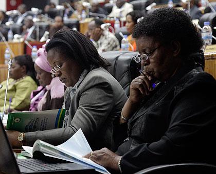 MPs read through the Ombudsman's report . The New Times/John Mbanda