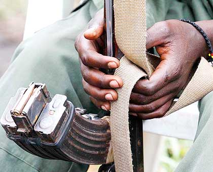 A rebel holds his gun in a past photo. The Congolese government says the attacks on key installations yesterday is an isolated case and not an attempted coup.   Net photo.