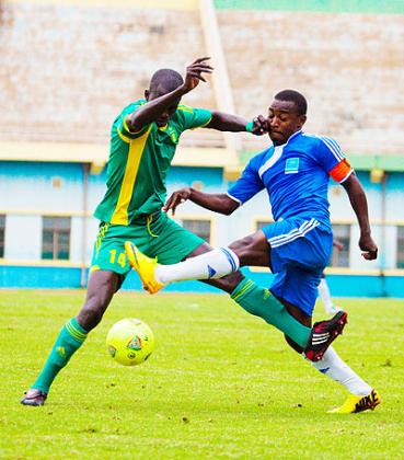 Rayon Sports captain Fuadi Ndayisenga battles with a Mauritania opponent during Tuesday's friendly match. Saturday Sport/T. Kisambira.