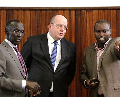 Supreme Court registrar Olivier Rukundakuvuga (R) shows Teeven (C) and Rugege around the court premises yesterday. The New Times/Courtesy