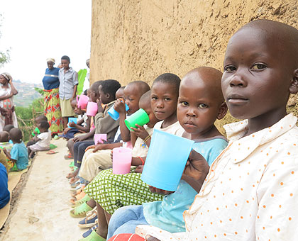 The orphans eat porridge. On this day, it is all they have for lunch. The New Times/Kim Harrisberg