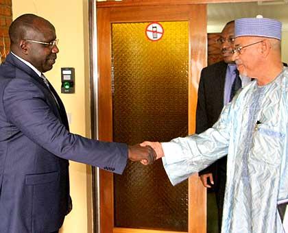 Niger's finance minister, Gilles Baillet (R), with Prime Minister Pierre-Damien Habumuremyi. Sunday Times/Courtesy