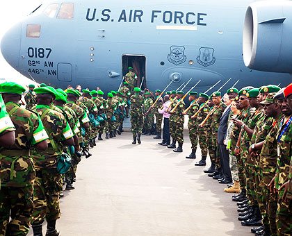 The first batch of RDF peacekeepers board a US plane at Kigali International Airport yesterday. The peacekeepers are being airlifted in phases to Bangui, the capital of restive Central African Republic.    The New Times/ T. Kisambira.