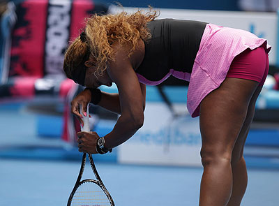 Serena Williams supports herself with a racket as she plays Ana Ivanovic during their fourth round match in Melbourne. Net photo.