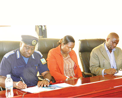 (L-R) IGP Emmanuel Gasana, Governor Odette Uwamariya and Ngoma District mayor, Aphrodise Nambaje sign the MoU. The New Times/ Stephen Rwembeho.