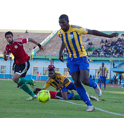 Jessy Reindorf (R) in action for Amavubi during a friendly match against Libya last year. Saturday Sport/ T. Kisambira.