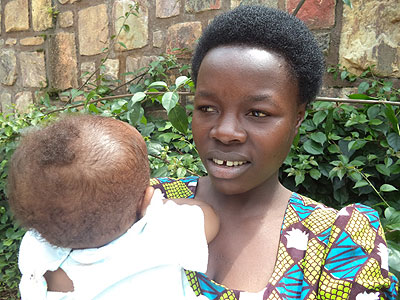  Alvera Uwimana with her child. Many single mothers countrywide toil to fend for themselves and their children. The New Times/Jean Pierre Bucyensenge.