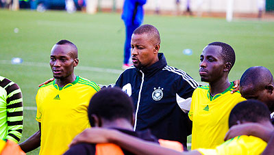 AS Kigali coach Andre Gasambungo (C) leads his team into a prayer before a previous league game. Times Sport /  T. Kisambira