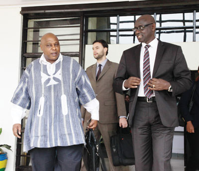 Justice Minister Johnston Busingye (right) chats  with the United Nations special rapporteur on the rights of freedom of assembly and association Maina Kiai. The New Times T.Kisambira. The New Times/ T.Kisambira.