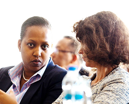 Sayinzoga (L) chats with Turk during the meeting in Kigali yesterday. The New Times/Timothy Kisambira