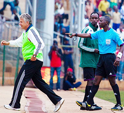 Andreas Spier (L) is directed to the stands by referee Hudu Munyemana following a confrotation with match officials on Saturday at Stade de Kigali. Times Sport/T. Kisambira.