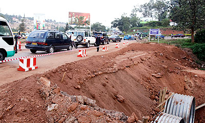 Traffic flow resumed on the road that was damaged by rain. The New Times/ John Mbanda. 