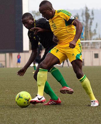 Jimmy Mbaraga (R) battles for ball possesion with an Academie Tchite defender during the first leg. Timothy Kisambira.