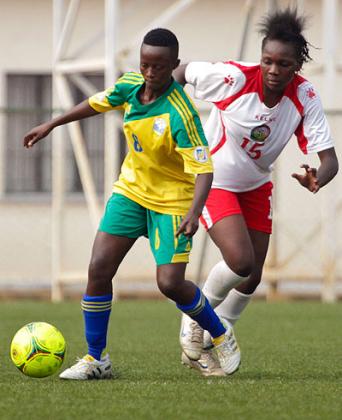 Striker Chadia Uwamahirwe dribbles past Kenyau2019s Doris Anyango in the first leg of the Africa women championship first round match played at Stade de Kigali yesterday.  T. Kisambira.