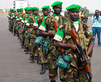 RDF peacekeppers boarding the USA Airforce plane to CAR. They have been urged to share their professional skills with other peacekeepers.  Timothy Kisambira.  